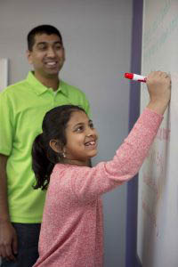 Teacher and Student at White Board Learning